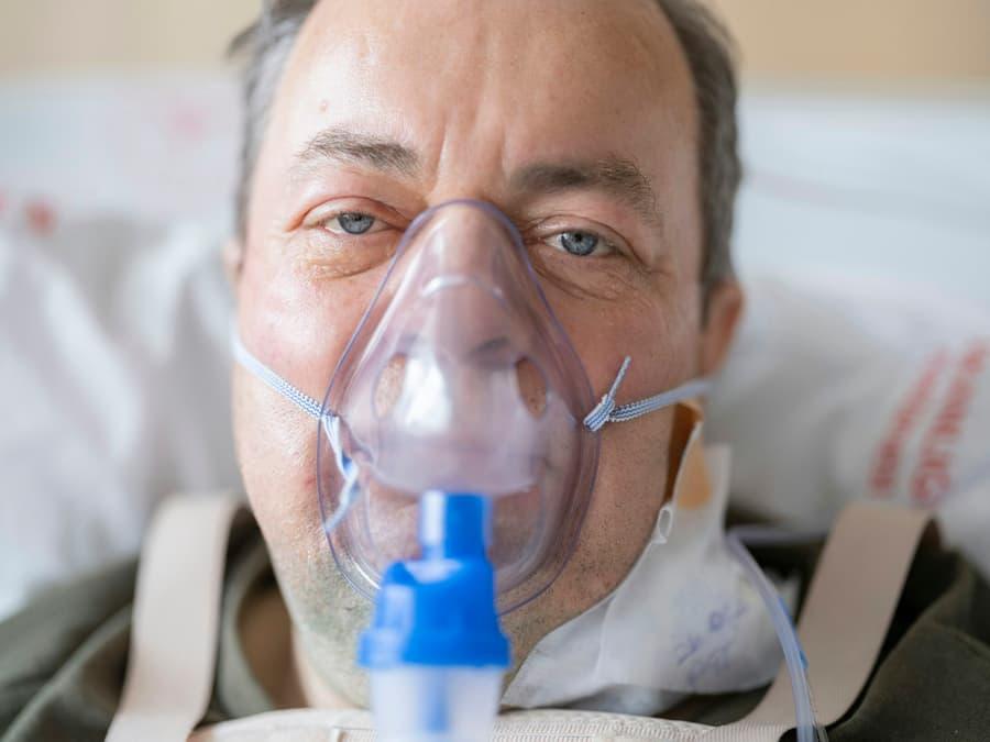 Patient using a respiratory oxygen mask