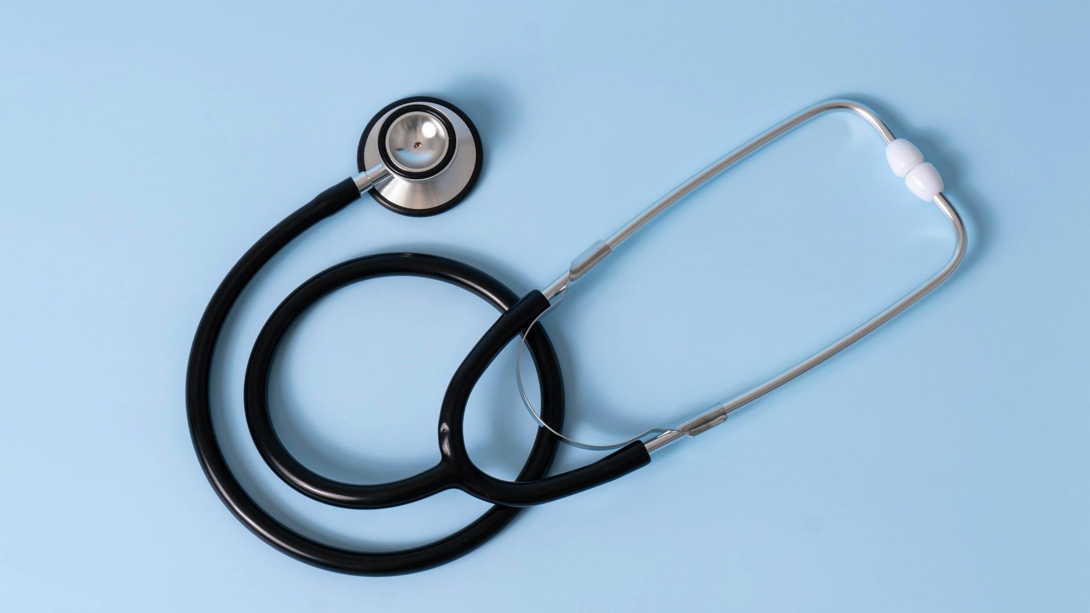 Stethoscope on a light blue background